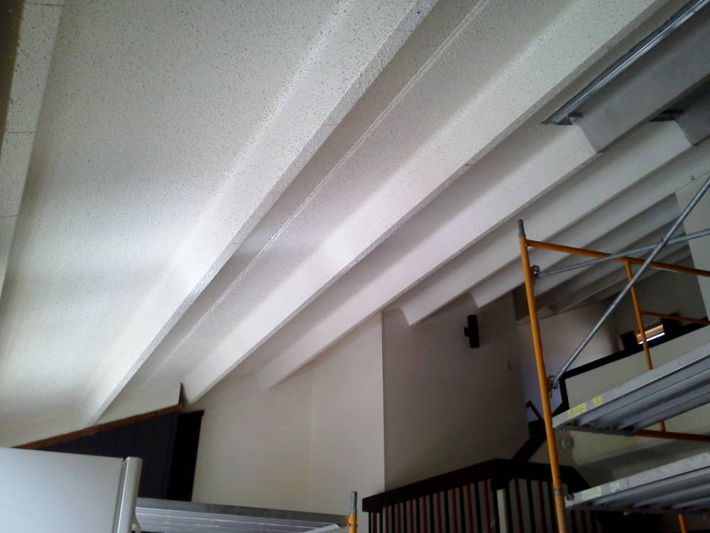 showing a concrete ceiling ready for suspended grid x ceiling installation.